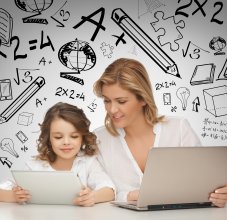 parent and student looking on computer