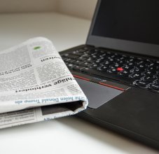 newspaper and computer